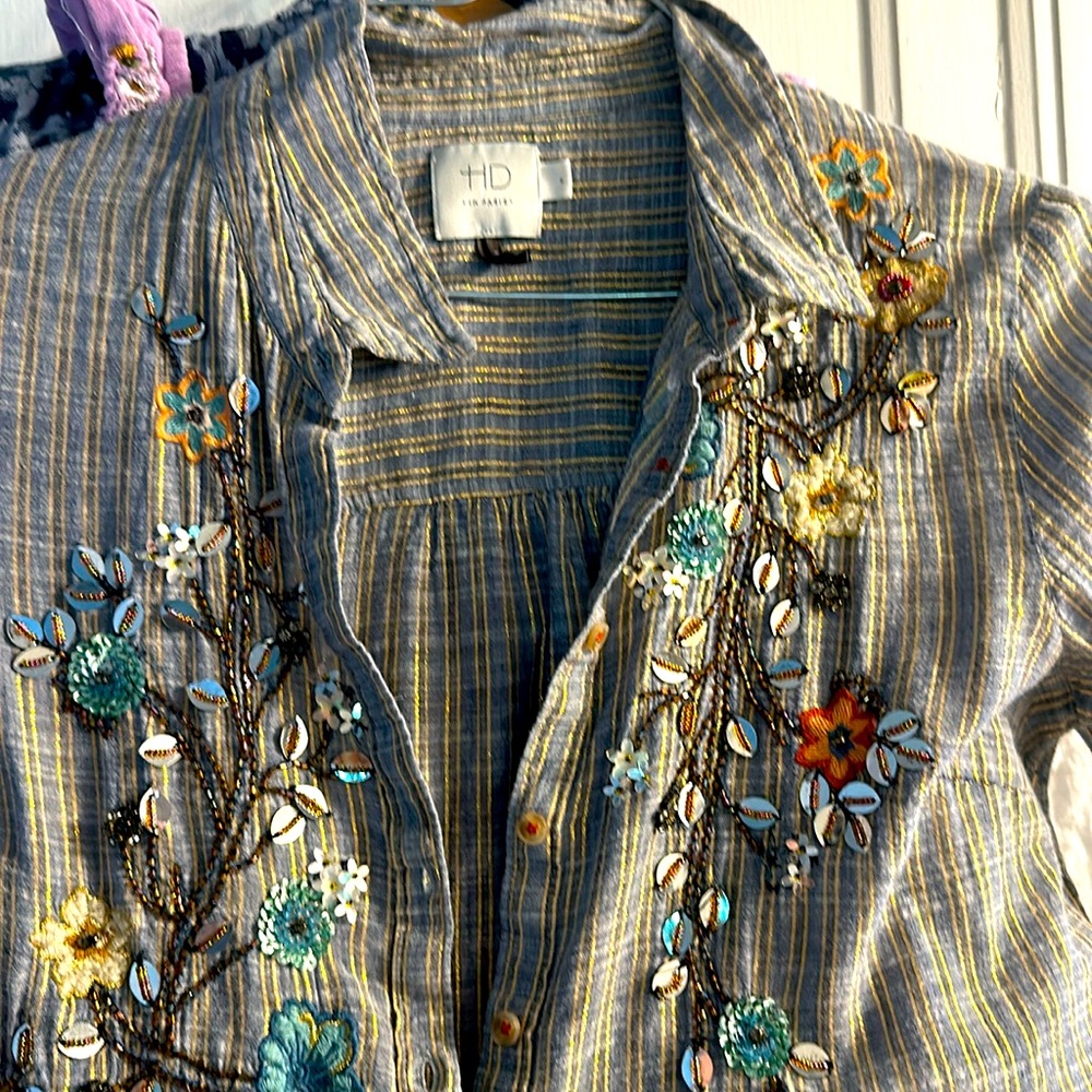 Anthropologie blouse with embroidered designs.